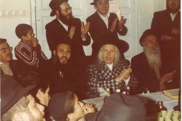 An archival photograph of rabbis and guests at a gathering