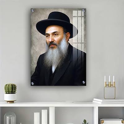 A framed portrait of Rabbi Nissim Yagen displayed above a shelf