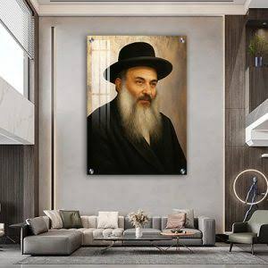 A portrait of Rabbi Nissim Yagen displayed above a sofa in an interior setting